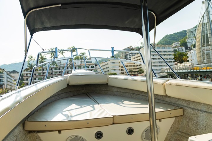 a boat sitting on top of a bridge