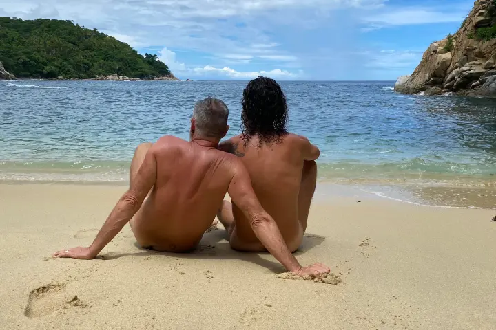 a man sitting on a beach